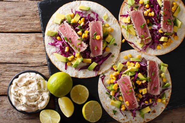 istock Tacos with tuna steak and fresh vegetables close-up. horizontal top view 1036052710