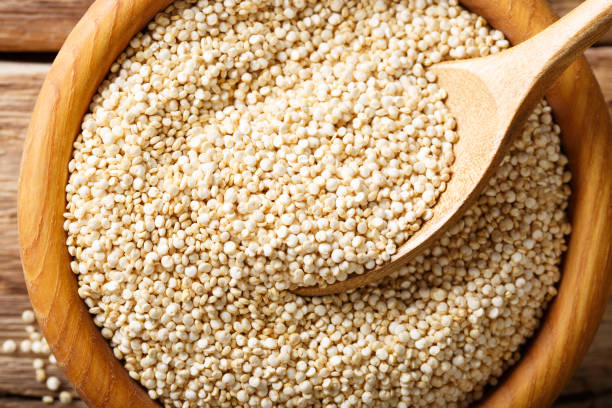 istock Dry white quinoa in a bowl macro. top view horizontal background 1036053832