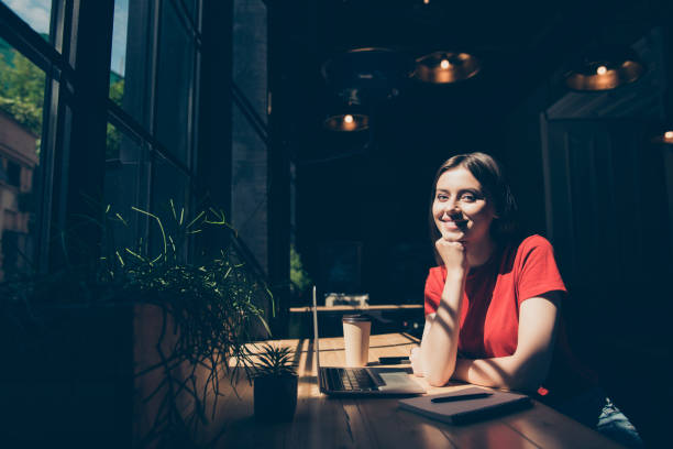 istock Attractive nice smiling young girl freelancer student wearing ca 1036058054