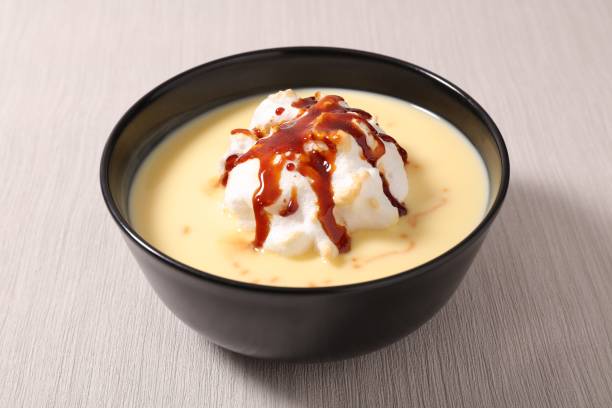 istock bowl of whipped egg, custard cream and caramel 1036063416