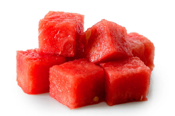 istock Pile of seedless watermelon cubes isolated on white. 1036072078