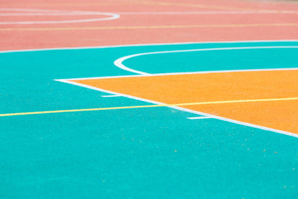 Fragment of an open basketball court with artificial surface.