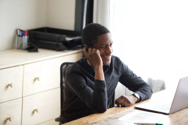 istock young businessman talking on phone at the office 1036091732