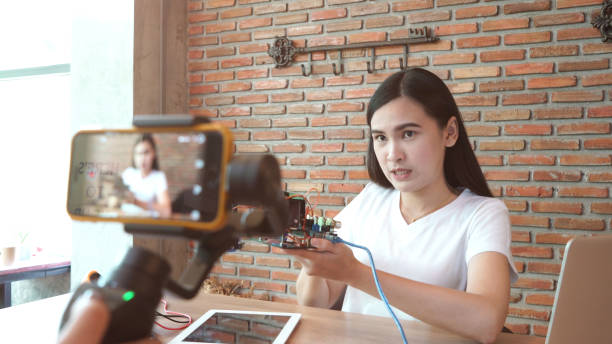 istock WoMan recording video for DIY stuff preparation 1036098098