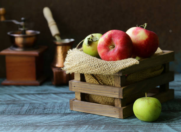 istock red apples on a wooden table 1036103826