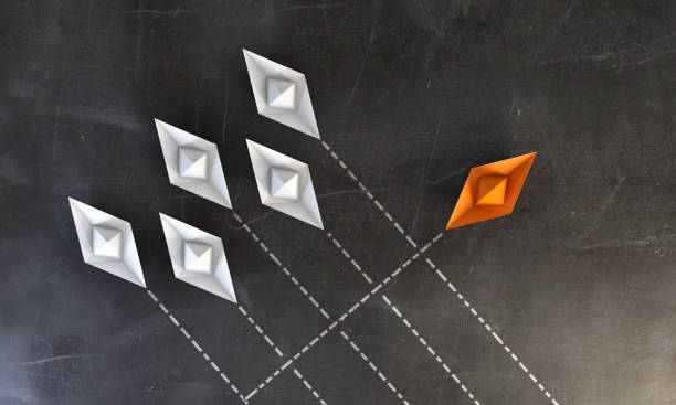 Paper Boats On Blackboard - Standing Out From the Crowd White paper boats going same direction, the orange one going to different direction. ( 3d render ) innovation individuality standing out from the crowd contrasts stock pictures, royalty-free photos & images