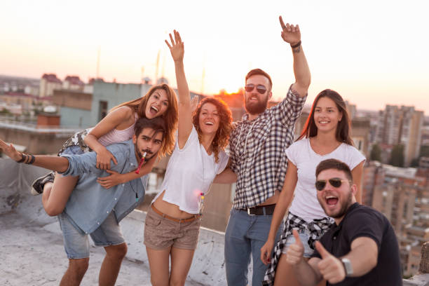 istock Friends having fun at a rooftop party 1036106792
