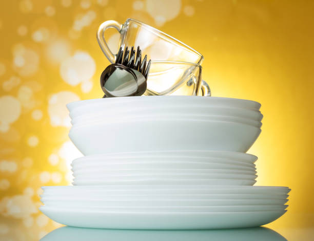 istock Cutlery and dishes on bright yellow background 1036107514