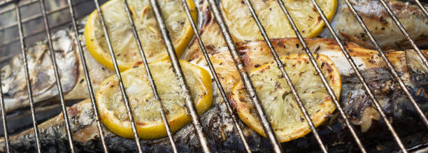 Mackerel baked on a grill with lemon