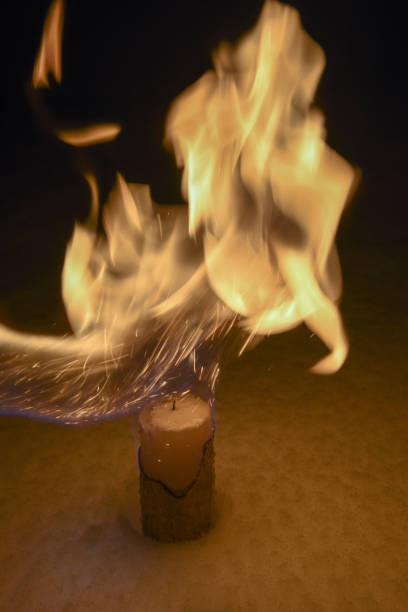 istock Burning candle on the Snow 1036112518
