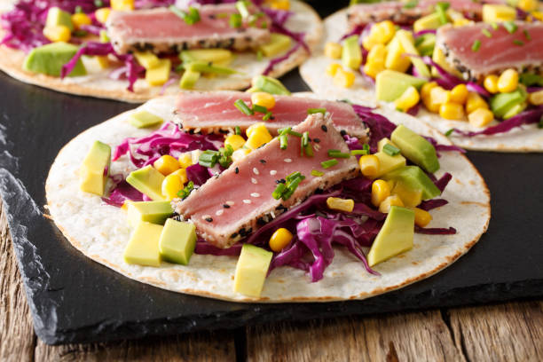istock Delicious fish tortilla with tuna and fresh vegetables close-up. horizontal 1036113492