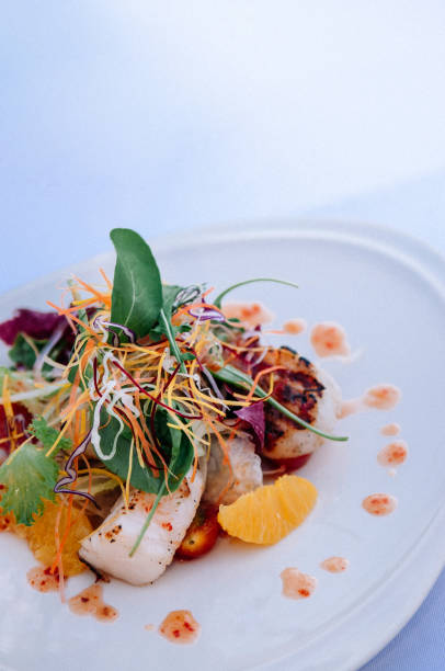 istock Mix green salad with seafood and orange 1036121548