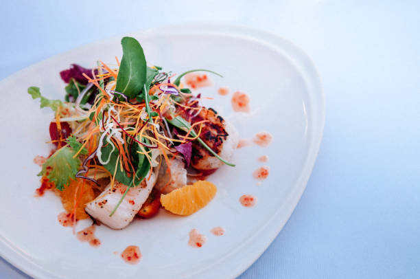 istock Mix green salad with seafood and orange 1036121588