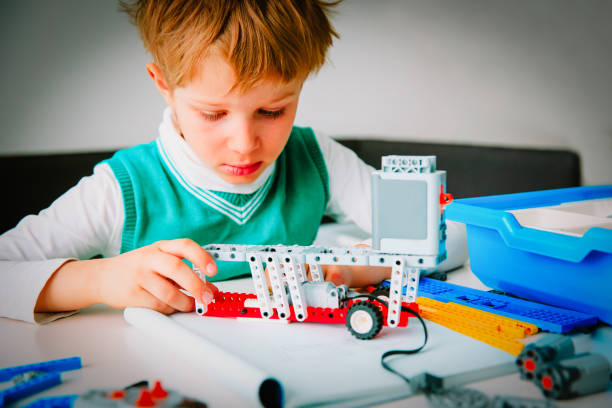 istock little boy building robot at robotic technology lesson 1036124990