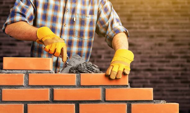 Masonry. Portrait of young profession man at work hand with a plaster spatula stock pictures, royalty-free photos & images