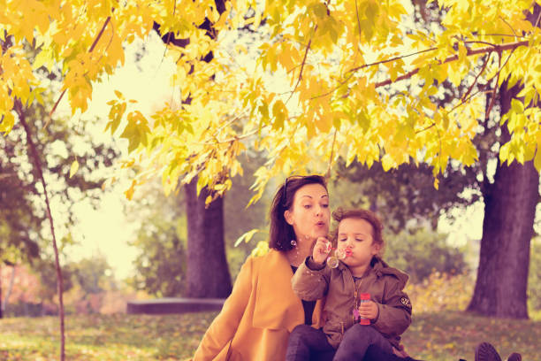 istock Blowing bubbles in autumn season. 1036126402