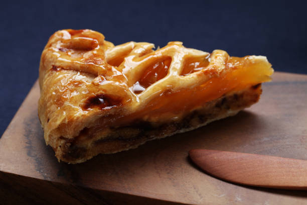 istock Slice of Rustic Apple Pie on cutting board on table 1036127478