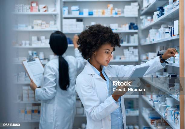Efficient Pharmacy Operations Thanks To Teamwork Stock Photo - Download Image Now - Pharmacy, Pharmacist, Medicine
