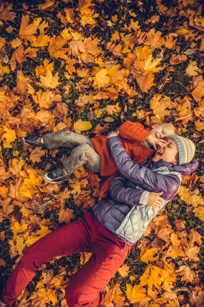 Mother and child in the park in autumn day