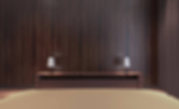 istock Bed at hotel room background - blurred and defocused 1036140890