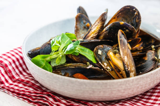 istock Mussel with white wine sauce on table 1036148998