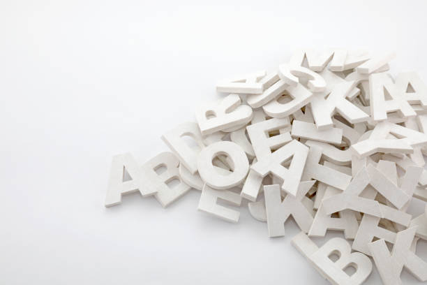 istock Pile of white painted wooden letters. Typography background composition. 1036162578