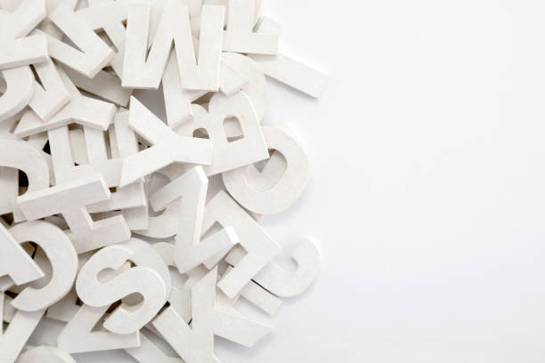 istock Pile of white painted wooden letters. Typography background composition. 1036162580
