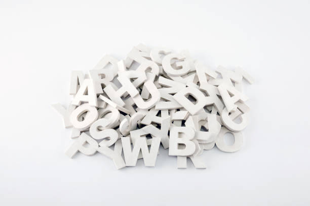 istock Pile of white painted wooden letters. Typography background composition. 1036162592