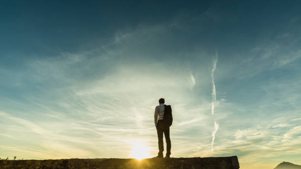istock Businessman standing on the skyline on a wall 1036165440