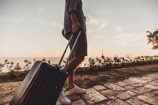 istock Tourist walking by the sea 1036165850