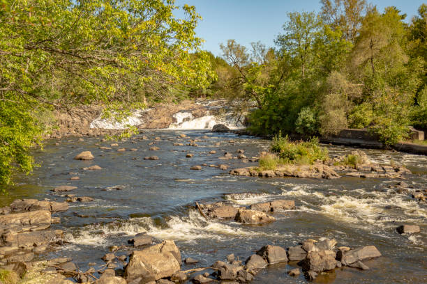 istock River with falls and rapids on a bright sunny day 1036165926