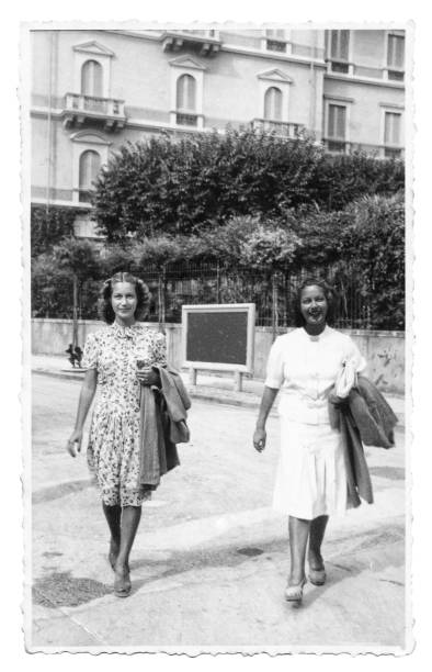 istock 1941 two friends walking on the street 1036169578