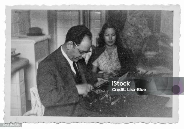 1941 Man And Woman With Typewriter Stock Photo - Download Image Now - Old-fashioned, Retro Style, Photography