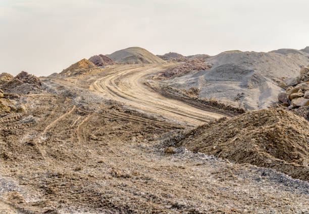 bumpy scenery bumpy scenery including lots of earth piles at a building lot gravel mound stock pictures, royalty-free photos & images
