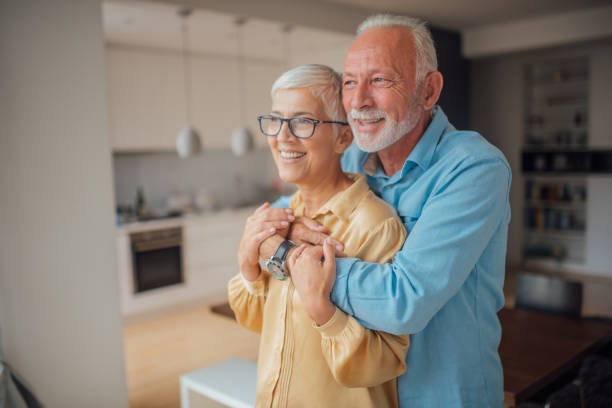 istock Husband and wife hugging at home 1036181510