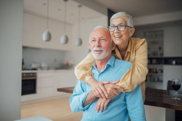 istock Happy senior couple hugging 1036186236