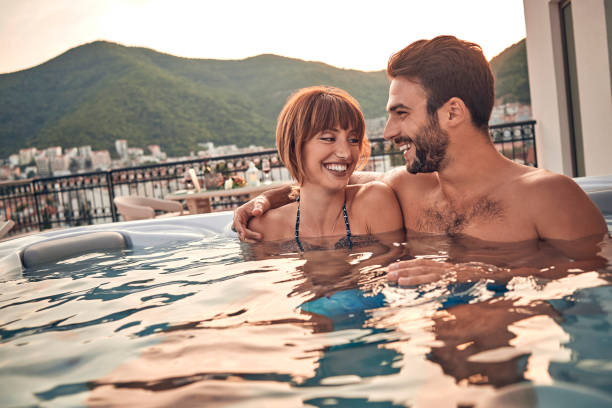 istock couple enjoying in hot tub 1036187088