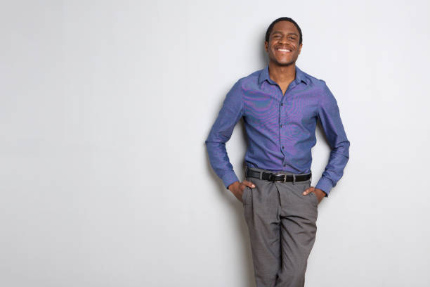 istock african american businessman smiling against white background 1036189876