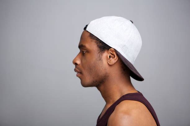istock Close up profile african american man with cap on backwards 1036189974