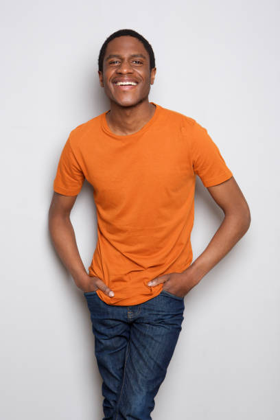 istock smiling african american man standing against white background 1036190026