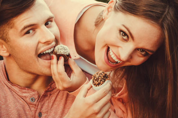 istock Smiling couple feeding each other. 1036190394