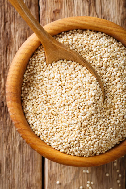 istock Dry white quinoa in a bowl macro. top view vertical background 1036201446