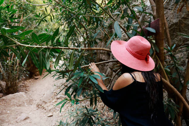 istock Young woman with hat at forest 1036201472