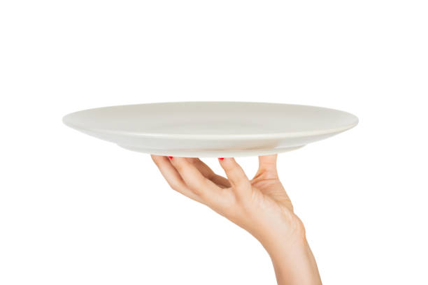 istock human hand with blank plate isolated on white background. perspective view, isolated on white background 1036220556