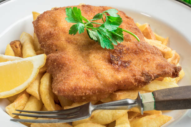 istock A piece of fried cod with fries on a plate. 1036220790