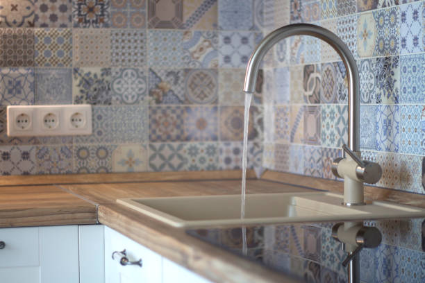 istock Water flows from the faucet in kitchen 1036224420