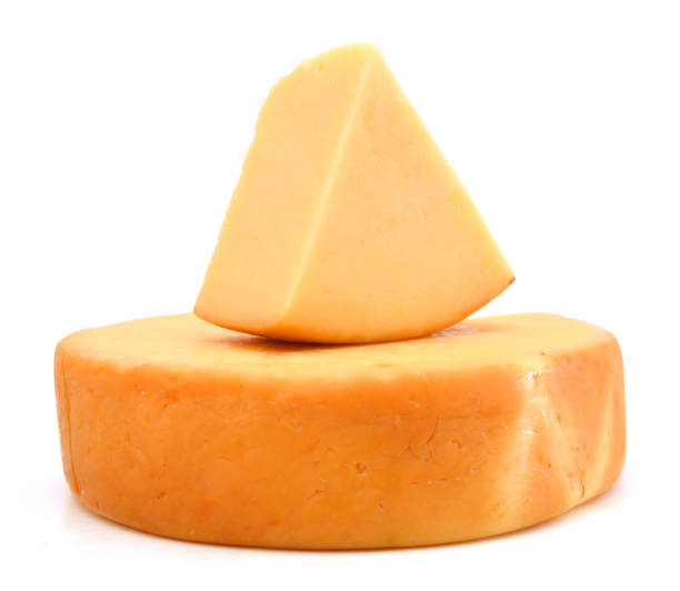 istock piece of cheese isolated on a white background 1036224728