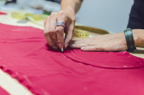 istock Female tailor making a dress in atelier 1036227324