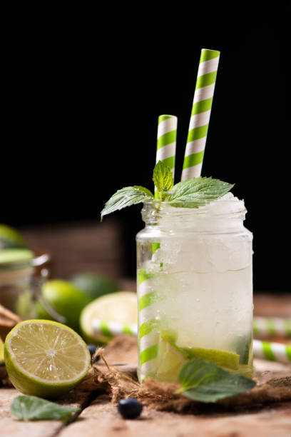 istock Caipirinha cocktail on wooden table 1036231512