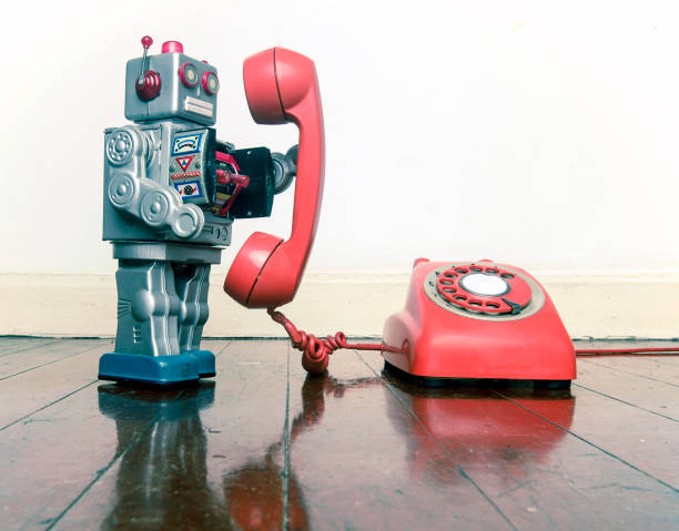 istock big silver robot toy on the phone 1036235288